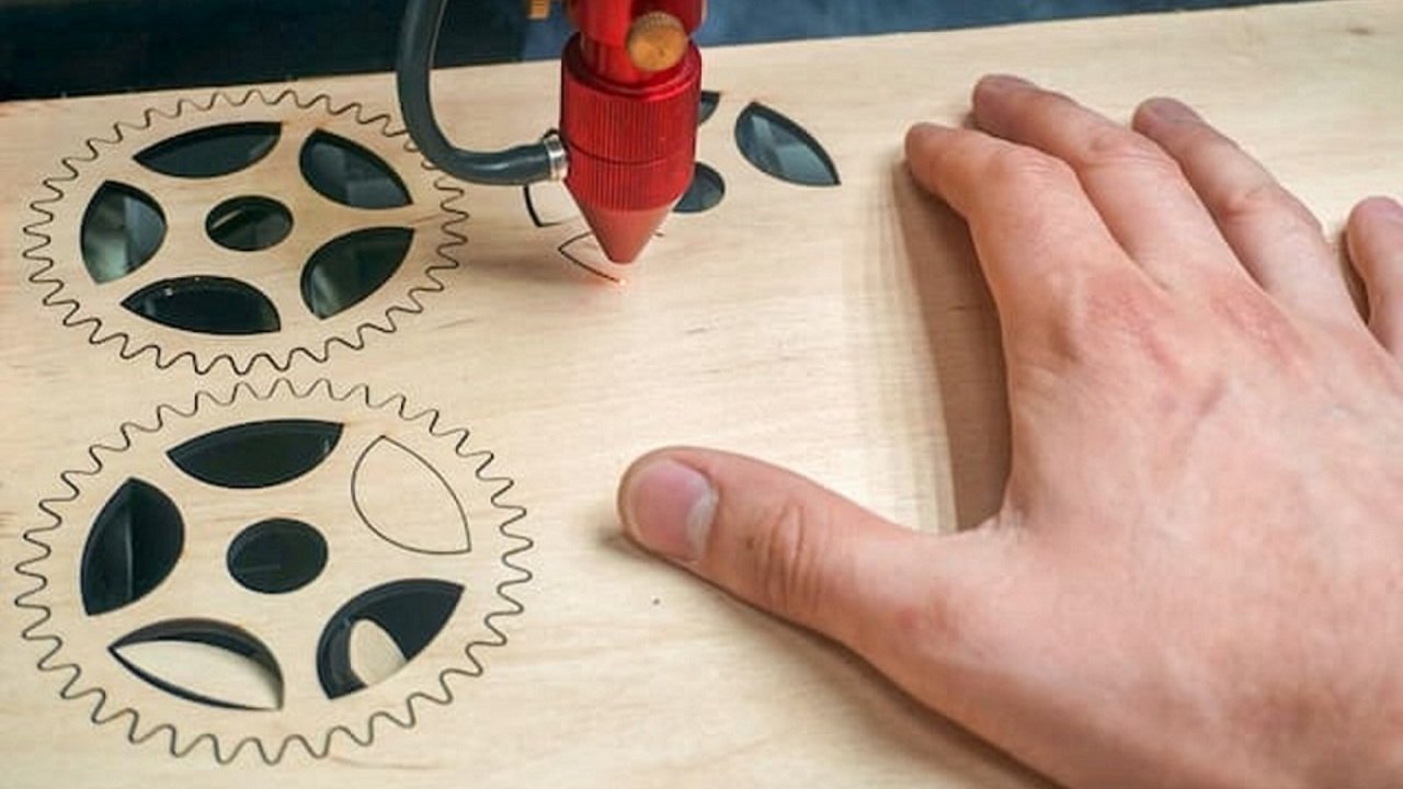 Image of laser cutter in action. Title image for the second section of this article. 